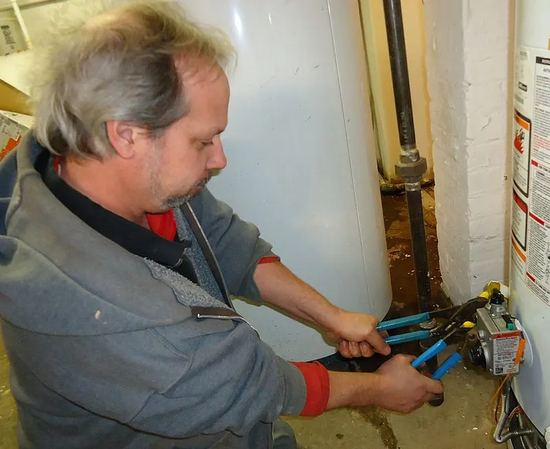 Plumbing contractor working in a residential home